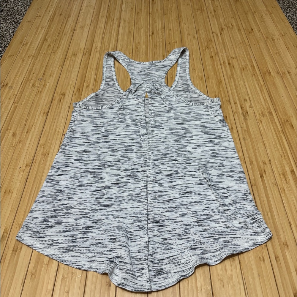 Lululemon tank with cut out back and optional back tie. No tags Measures a  4. - Picture 2 of 7